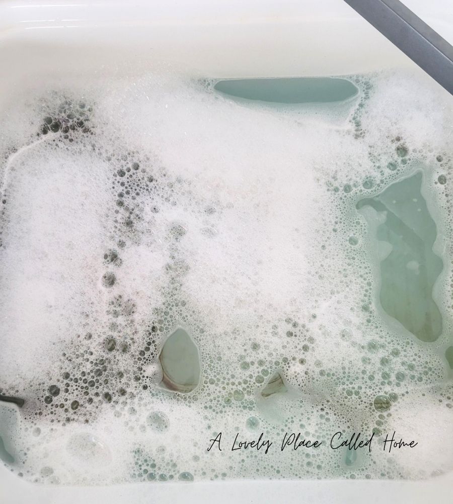 dishes in soapy water 