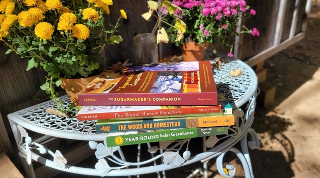 stack of homesteading books for fall 